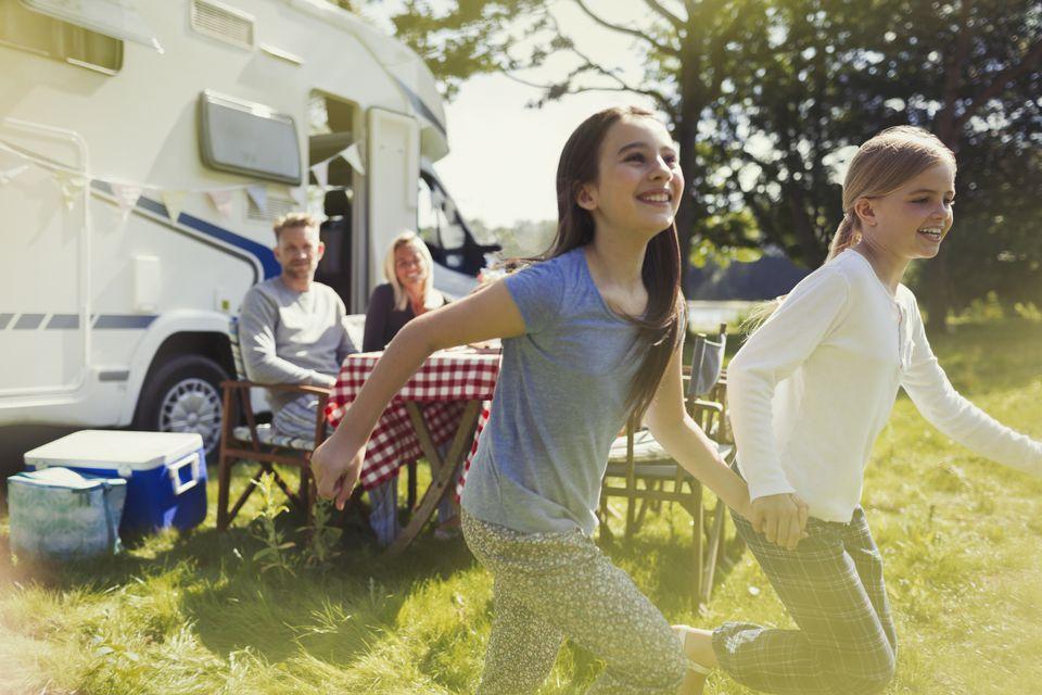 RV Family with two girls running