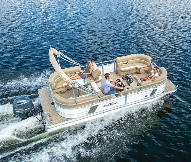 Family riding in pontoon on water