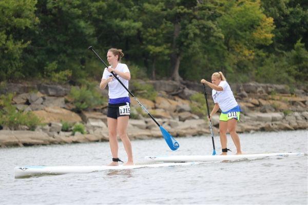 Two people stand up paddleboarding